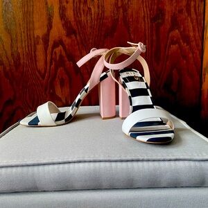Womens heel with black and white striped sole and pink heel